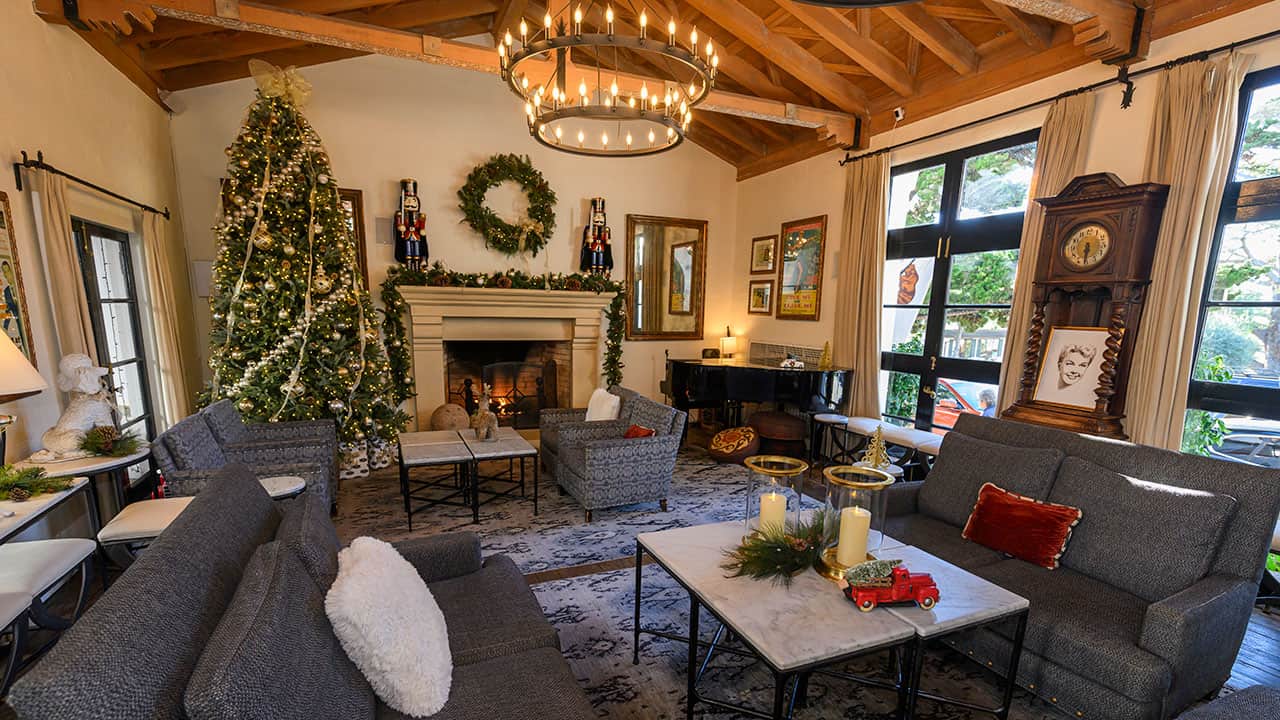 Cypress Inn Living Room And Fireplace With Christmas Decorations